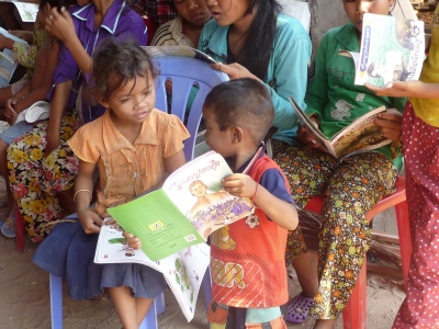 young children sharing book